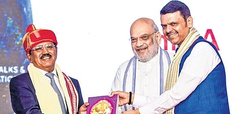 Home Minister Amit Shah and Maharashtra CM Devendra Fadnavis felicitating NSA Ajit Doval (L) with Lokmanya Tilak National Award in Pune on Saturday