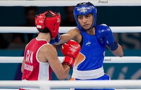 India's Preeti Pawar, in blue, competes against Canada's Scarlett Delgado during the Women's 54kg boxing final at the Commonwealth Games 2026.