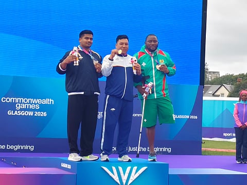 Soman Rana (C) poses with gold medal on Saturday
