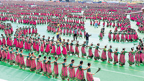 Tribal girls performing Dhimsa dance at Bhogapuram airport on Friday 