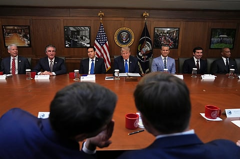 President Donald Trump, seated center, joined by Energy Secretary Chris Wright, from left, Interior Secretary Doug Burgum, Secretary of State Marco Rubio, Defense Secretary Pete Hegseth, acting Labor Secretary Keith Sonderling, and Housing and Urban Development Secretary Scott Turner, attends a cabinet meeting, Friday, July 31, 2026, at Camp David, the presidential retreat, near Thurmont, Md., Friday, July 31, 2026.