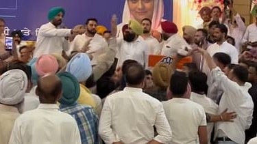 Punjab Congress chief Amarinder Singh Raja Warring is seen appealing to the workers to maintain discipline and allow the meeting to continue.