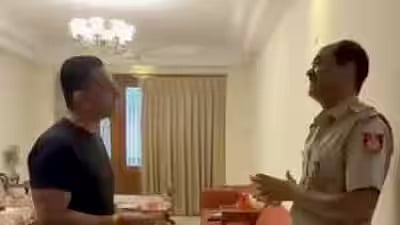 Activist Tehseen Poonawalla talking to a police officer.