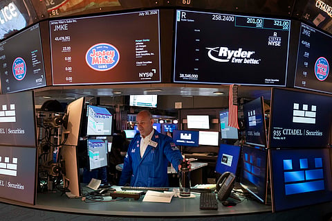 Specialist Mark Fitzgerald works on the floor of the New York Stock Exchange, Thursday, July 30, 2026, in New York. 