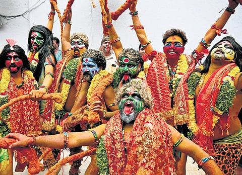 Potharajus pose during the ghatam procession for the Lal Darwaza Mahankali temple in Old City of Hyderabad on Sunday | Vinay Madapu