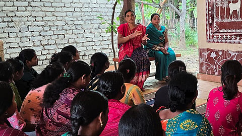 Maithilee Bhue interacting with women members of the community