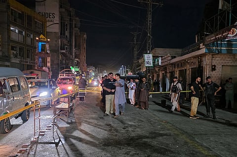 Police personnel cordon off a street following a suicide bombing during a protest in Pakistan's Swat district on August 2, 2026.