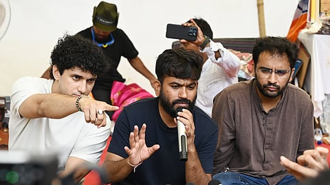 In this photo from July 24, 2026, Cockroach Janta Party (CJP) Founder Abhijeet Dipke (C) addresses a press conference at Jantar Mantar protest site alongside party spokespersons Saurav Das (L) and Ashutosh Ranka (R) in New Delhi.