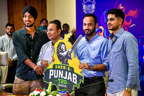 Punjab Cricket Association (PCA) Chairman Meet Hayer (2nd R), Shubman Gill (R) and Arshdeep Singh (L) and others during the launch