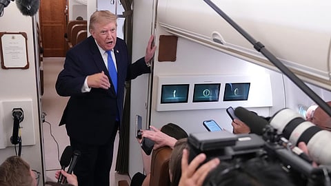 President Donald Trump speaks to reporters onboard Air Force One while returning to the White House, Sunday, Aug. 2, 2026. 