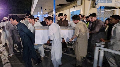 People carry a casket of a victim of suicide bombing, to transport after collecting from a hospital in Mingora, the main town of the Swat Valley in Pakistan's Khyber Pakhtunkhwa province on August 2, 2026. 