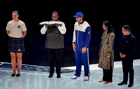 Commonwealth Sport President Donald Rukare (2nd left) hands over the Commonwealth Games Federation flag to Indian javelin thrower Neeraj Chopra (centre) during the closing ceremony of the 23rd Commonwealth Games in Glasgow, Scotland, Sunday. Indian Olympic Association (IOA) President PT Usha (2nd right) and Gujarat Deputy Chief Minister Harsh Sanghavi (right) are also seen. 