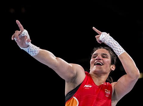 Arundhati Choudhary celebrates after capturing the gold medal (women's 70kg) in the Commonwealth Games in Glasgow