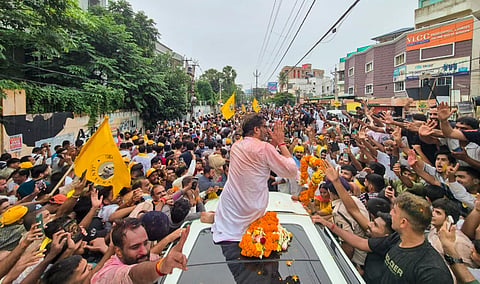 Jan Suraaj Party chief Prashant Kishor celebrates with supporters after taking the lead in the Bankipur Assembly by-election during the counting of votes, in Patna, Bihar.