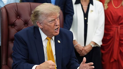 President Donald Trump gestures as he speaks during a meeting about military families, in the Oval Office of the White House, Monday, Aug. 3, 2026, in Washington.