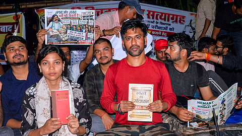 Students hold placards during a protest against the Jharkhand government over alleged irregularities in examinations conducted by the Jharkhand Public Service Commission (JPSC) and the Jharkhand Staff Selection Commission (JSSC), in Ranchi, Jharkhand, Monday, Aug. 3, 2026.
