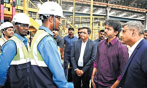 CM C Joseph Vijay interacts with workers during his visit to the Saint-Gobain glass manufacturing complex in Sriperumbudur on Monday.