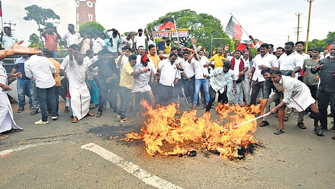(From top) DMK members burning an effigy of Vijay in Thanjavur on Tuesday; a 
road roko staged in Madurai against Udhayanidhi’s arrest