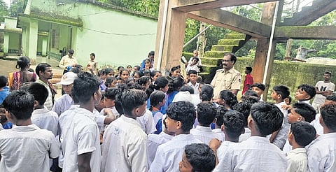 The students protesting in front of the Ashram school 