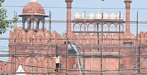 Workers are busy with preparations at the Red Fort on Wednesday, as Delhi Police tightens security arrangements ahead of the Independence Day | parveen negi
