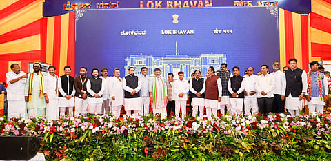 Karnataka Chief Minister DK Shivakumar and Governor Thawar Chand Gehlot pose with newly inducted ministers