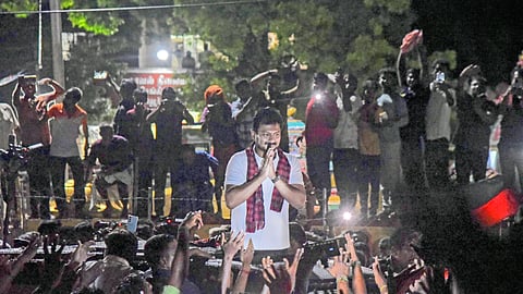 Udhayanidhi Stalin greeting supporters after coming out from Sengipatti police station on Tuesday night 