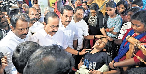 Chief Minister V D Satheesan, after paying tributes to Rajesh, tries to console his son Arshan.