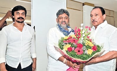 Chief Minister DK Shivakumar greets Congress MLA M Krishnappa in Bengaluru on Wednesday. MLA Priya Krishna is also seen 