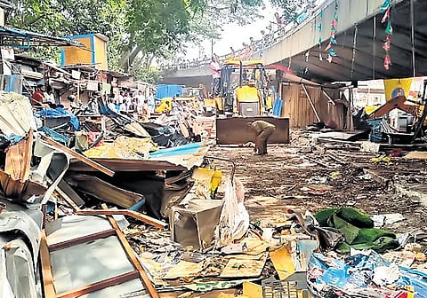GBA workers demolish structures on footpaths at City Market in Bengaluru on Wednesday 
