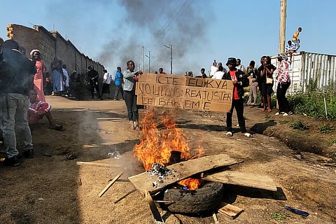 Rubble set on fire as health and frontline workers protest at the Elikya Ebola Treatment Center in Bunia, Congo, on Saturday, July 25, 2026. 