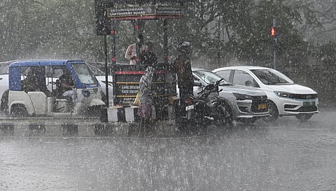 Heavy rain lashes the city as motorists navigate rain-soaked roads near the Secunderabad Cantonment Board in Secunderabad