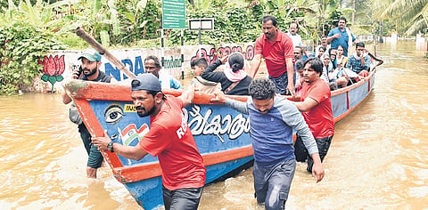 Volunteers evacuate residents stranded in flooded houses in parts of Mallappuzhassery panchayat, Aranmula.