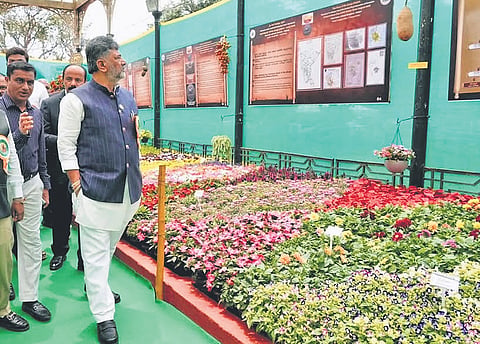 CM DK Shivakumar goes on a round of the venue after inaugurating the Lalbagh Flower Show on Thursday