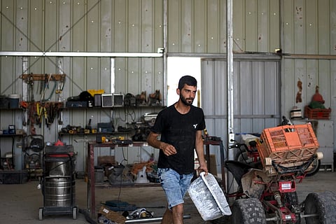 Yinon Levi works on his farm in the South Hebron Hills, West Bank, May 12, 2024.