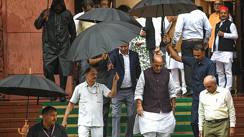 Union Defence Minister Rajnath Singh leaves the Parliament premises amid rain during the ongoing Monsoon Session, in New Delhi on Thursday, Aug 06, 2026.