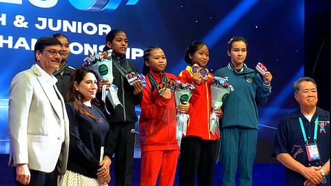 Titli Maji (fifth from right) on the podium