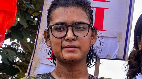 All India Student's Association (AISA) National President Neha Bora after a man threw ink on her during a protest against the alleged irregularities of examinations conducted by Jharkhand Public Service Commission (JPSC) and Jharkhand Staff Selection Commission (JSSC), in Ranchi. 