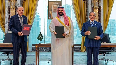From left to right: Turkish President Recep Tayyip Erdogan, Saudi Crown Prince Mohammed bin Salman and Pakistani Prime Minister Shehbaz Sharif pose after signing a trilateral defense agreement in Mecca, Saudi Arabia, Friday, Aug. 7, 2026.
