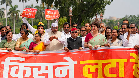  LoP in the Rajya Sabha Mallikarjun Kharge, Congress MP Priyanka Gandhi Vadra, Samajwadi Party MP Awadhesh Prasad, and others, stage a protest over alleged theft of Ayodhyas Ram temple donations during the Monsoon session of Parliament, in New Delhi, Wednesday, Aug. 12, 2026. 