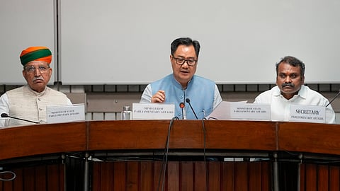 Union Parliamentary Affairs Minister Kiren Rijiju addresses a press conference after both Houses of Parliament adjourned sine die as the Monsoon session concludes, in New Delhi, Thursday, Aug. 13, 2026. MoS for Parliamentary Affairs Arjun Ram Meghwal, left, and L Murugan, right, are also present.