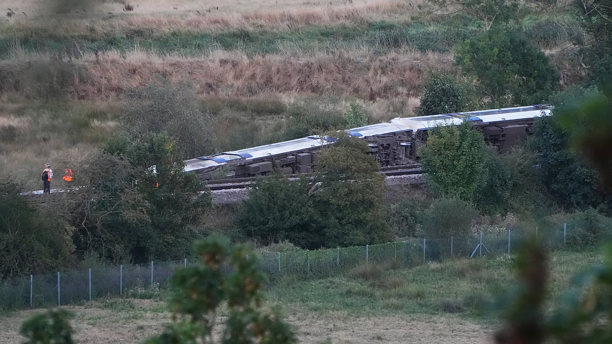 Passenger train derails and 11 people injured after carriages overturn in southern England