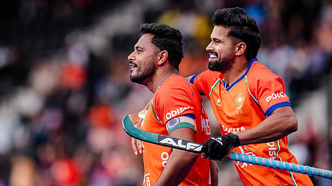 Abhishek (right) and Harmanpreet Singh scored four goals between them to help India to a big 5-3 win over Pakistan in the hockey World Cup on Wednesday