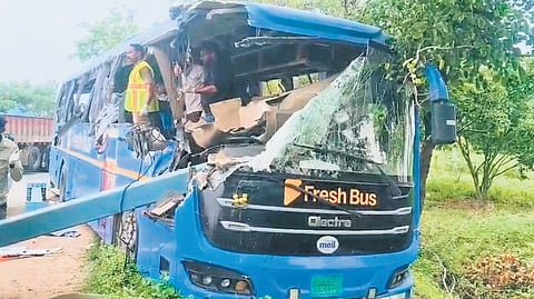 The front portion of the private travels bus that was completely wrecked after it crashed into a container carrying iron pillars near Dorakunta in Kodad mandal.