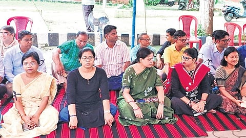 The teachers sitting in front of the V-C’s office on Friday.