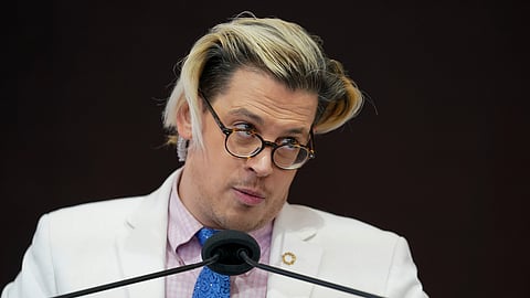Activist Milo Yiannopoulos speaks during a rally outside of the Baltimore hotel where the United States Conference of Catholic Bishops are holding its Fall General Assembly meeting in Baltimore.