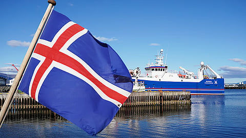 An Icelandic flag waves in the wind at Reykjavik Harbor in Reykjavik, Iceland.