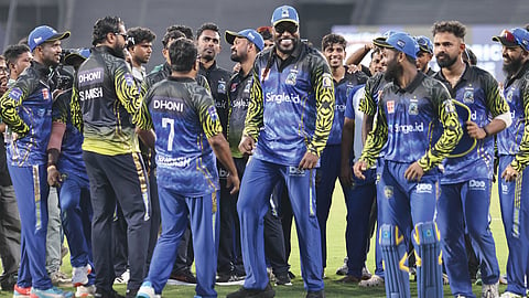 Former West Indies cricketer and Kochi Blue Tigers co-owner Chris Gayle with team players at Greenfield Stadium in Thiruvananthapuram on Saturday after their victory against Thrissur Titans in the Kerala Cricket League match 