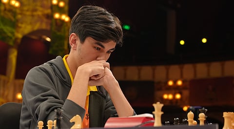 Javokhir Sindarov deep in thought before making a move