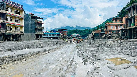 In Galchhi, about 50 km northwest of Kathmandu, residents are clearing mud and debris from their damaged homes.
