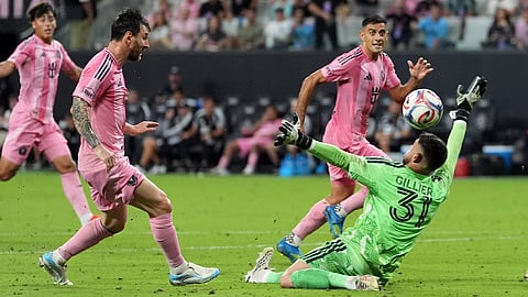 Inter Miami forward Lionel Messi, left, scores his third goal of the match, his side's fifth, past CF Montreal goalkeeper Thomas Gillier (31) during the second half of an MLS soccer match, Saturday, Aug. 29, 2026, in Miami.